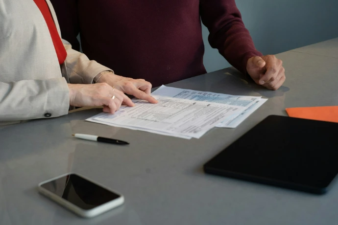 Visual graphic detailing UAE Corporate Tax services, including registration, return filing, tax planning, small business relief, and free-zone (QFZP) guidance.